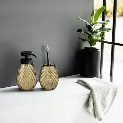 WENKO Badaccessoire-Set »Modell Idro Gold« Seifenspender und Zahnputzbecher aus Keramik mit Linien-Struktur